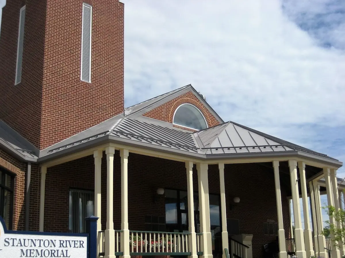 Skilled roofing craftsmen working on a residential roof in Avlon